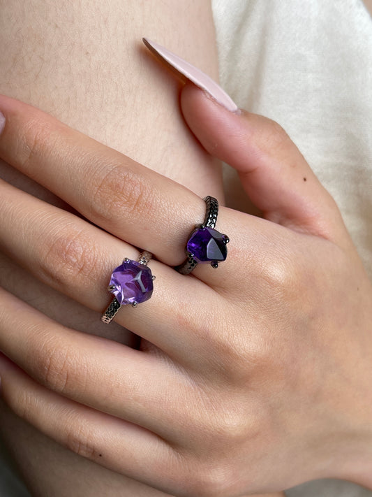 Close up of Brazilian amethyst freeform ring worn on hand