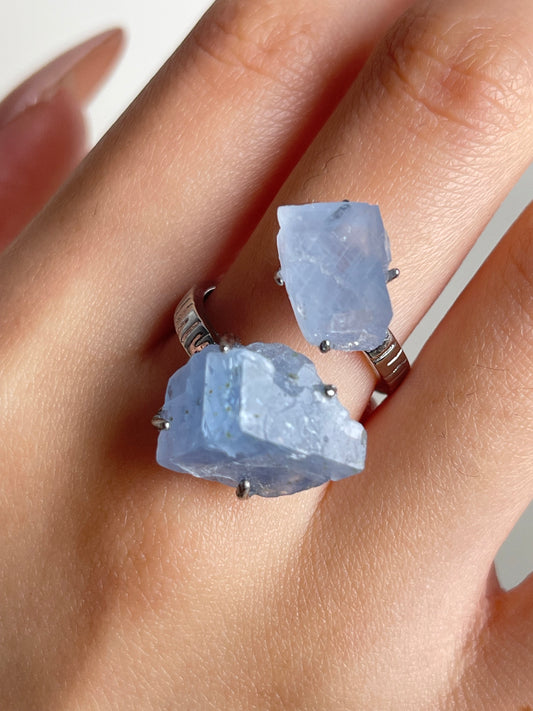 Close-up of Blue Calcite twin stone ring mineral specimen jewelry worn on hand
