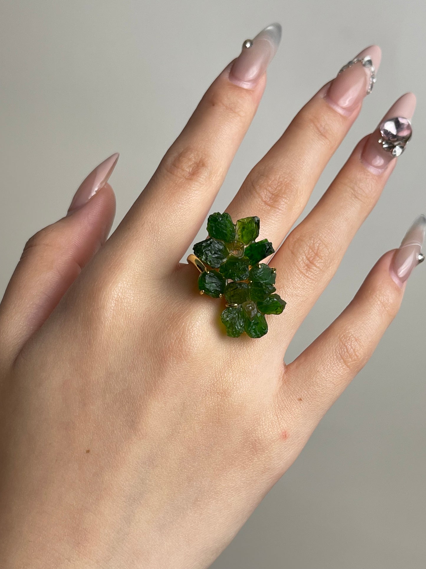 Chrome Diopside and Citrine raw crystal floral ring worn on hand