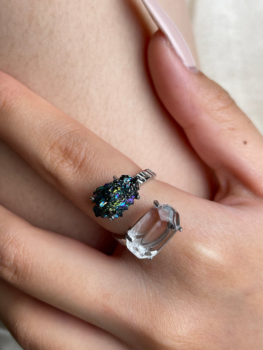 Close up of Clear Quartz and Carborundum ring on hand
