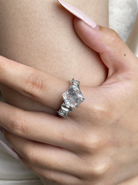 Close-up hand view of Clear Quartz cube ring with Herkimer Diamond Quartz side stones