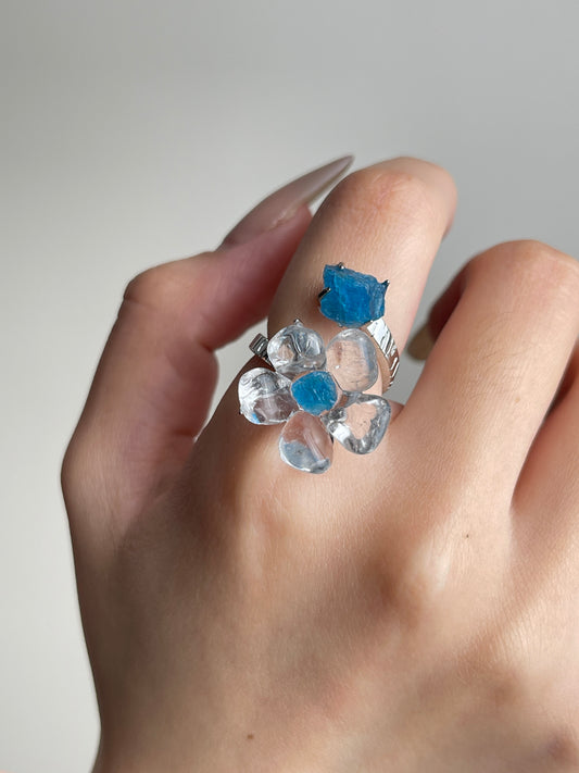 Close-up hand view of Clear Quartz Flower Ring with raw Blue Apatite
