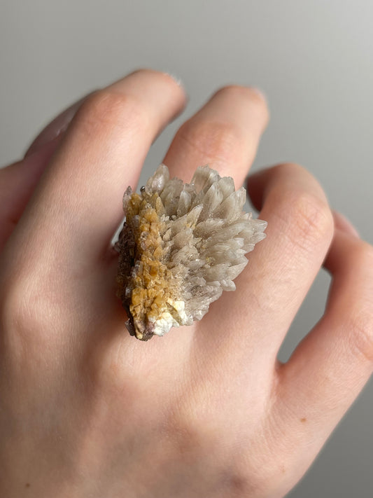 Creedite mineral specimen ring close-up on hand