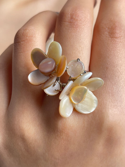 Close-up hand shot of double Mother of Pearl flower ring