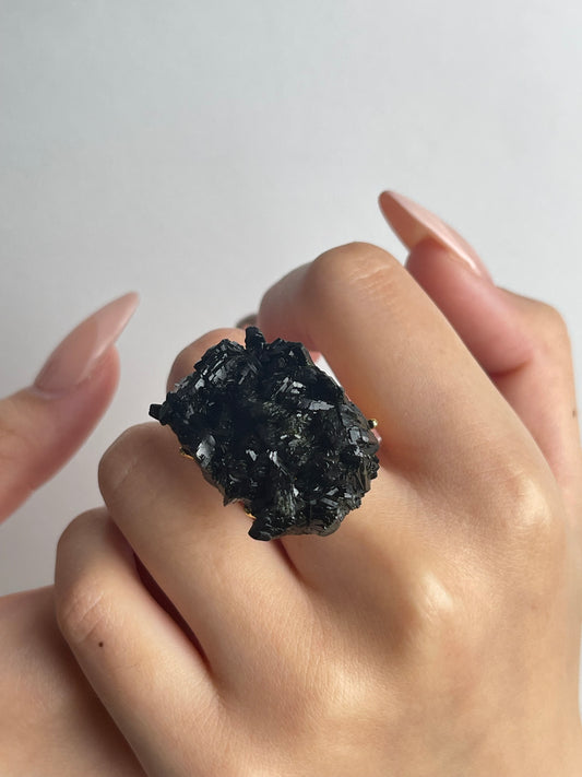 close up natural epidote crystal ring mineral specimen