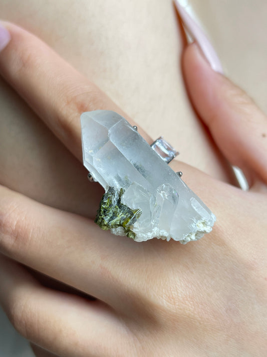 Close-up of Epidote and Quartz Crystal Point Ring worn on hand