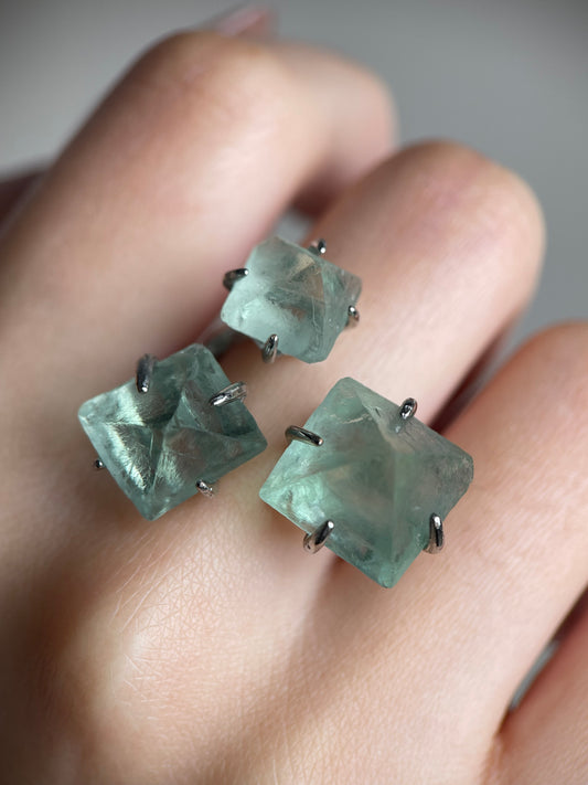 octahedral fluorite ring close up on hand green crystal