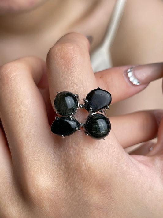 Close-up hand shot of Green Rutilated Quartz and Smoky Quartz ring