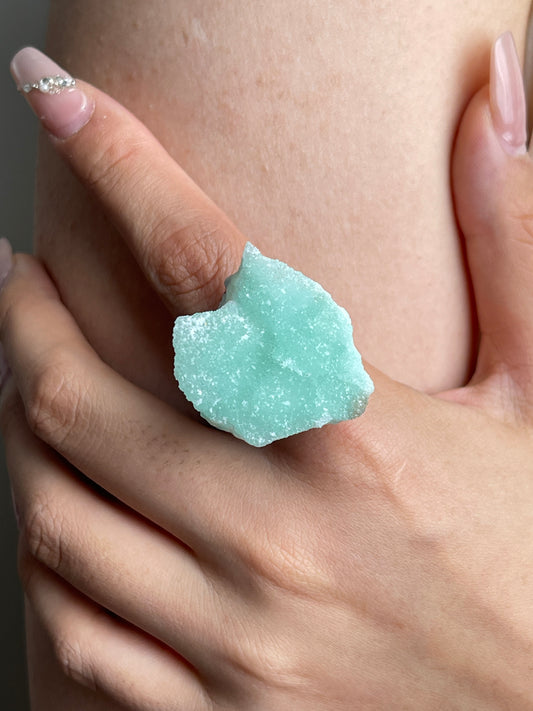 Close-up of hemimorphite ring showing fine crystal texture and natural surface
