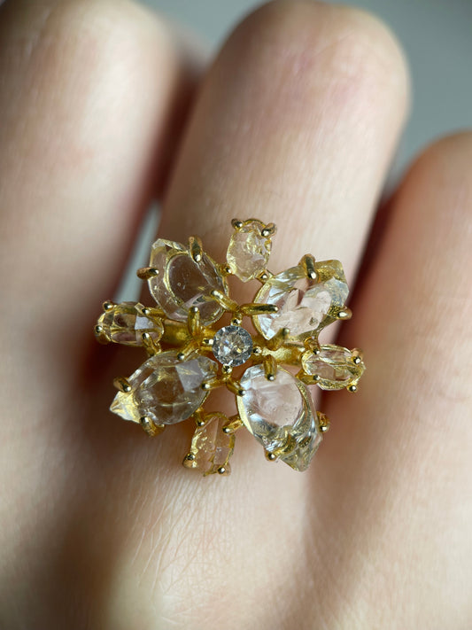 Close-up hand shot of Herkimer Diamond Quartz snowflake ring showing clear double-terminated crystals
