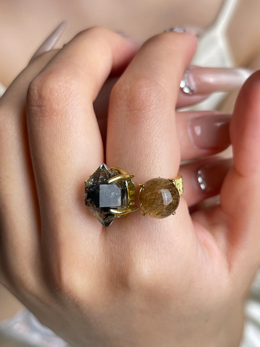 Close-up hand shot of Herkimer Diamond Quartz and Rutilated Quartz Ring by Oryssia