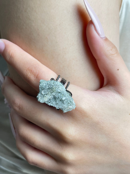 Close-up hand wearing Himalayan Green Phantom Quartz cluster ring