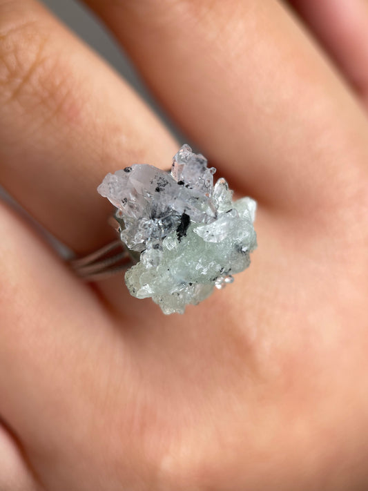 prehnite quartz magnetite ring on hand green crystal close up