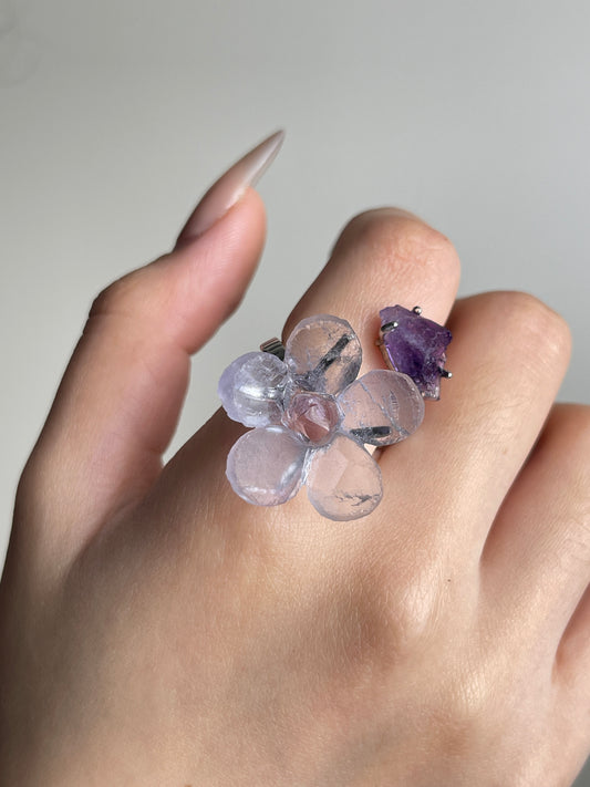 Close-up of Purple Fluorite and Amethyst crystal flower ring worn on hand