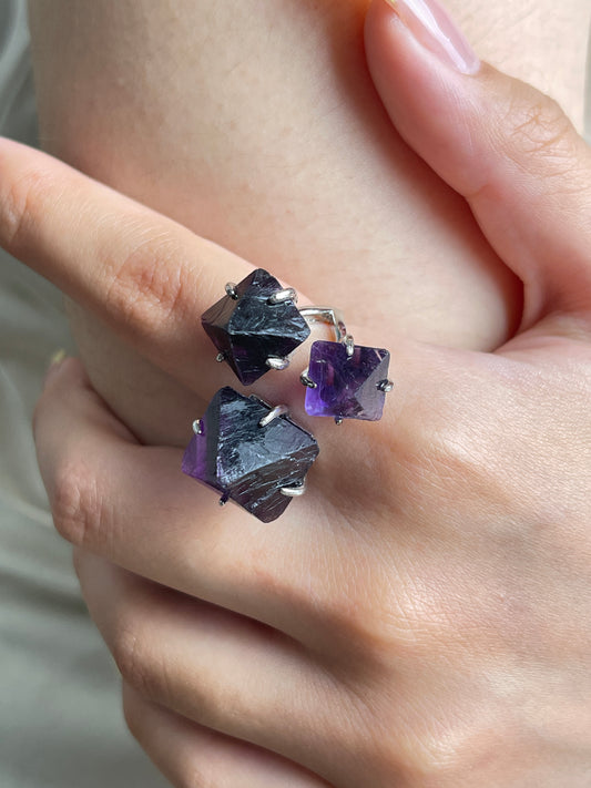 Close up of purple octahedral fluorite ring worn on hand