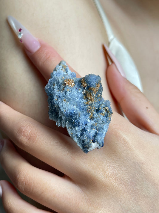 Close-up of Raw Blue Sapphire Crystal Cluster Ring worn on hand
