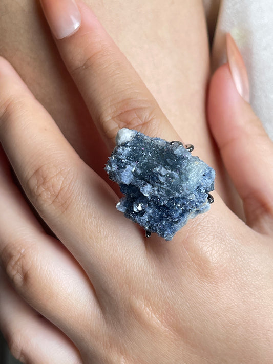 Raw Blue Sapphire Crystal Ring, close-up on hand