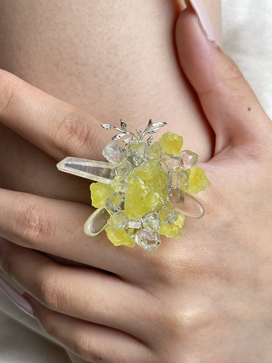 Close up hand wearing raw Brucite and Herkimer Diamond Quartz mineral specimen ring