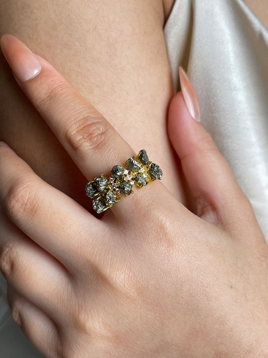 Raw Chalcopyrite Row Ring from Peru, close-up on hand