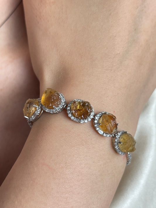 Close-up of raw citrine bracelet with natural citrine stones worn on wrist