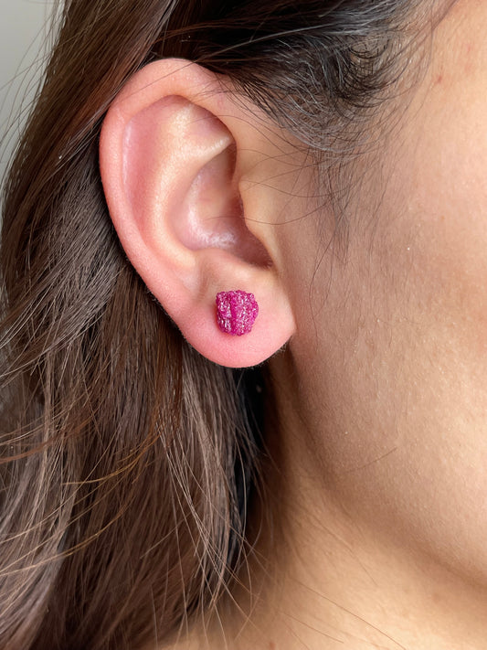 Raw Red Corundum Stud Earrings close-up worn on ear