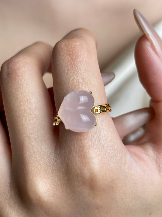 Close-up hand shot of Rose Quartz Heart Ring by Oryssia