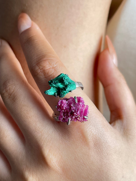Close-up hand shot of ruby and fibrous malachite twin stone ring
