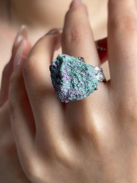 Ruby in fuchsite raw crystal ring close-up on hand