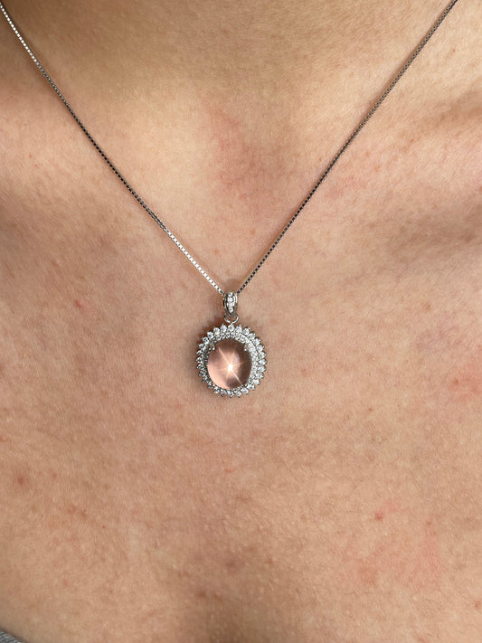 Close-up of star rose quartz necklace Madagascar worn on neck