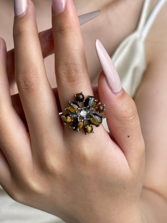 Tiger’s eye cabochon cluster ring worn on hand