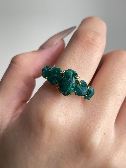 Close-up of Raw Dioptase Crystal Band Ring worn on hand