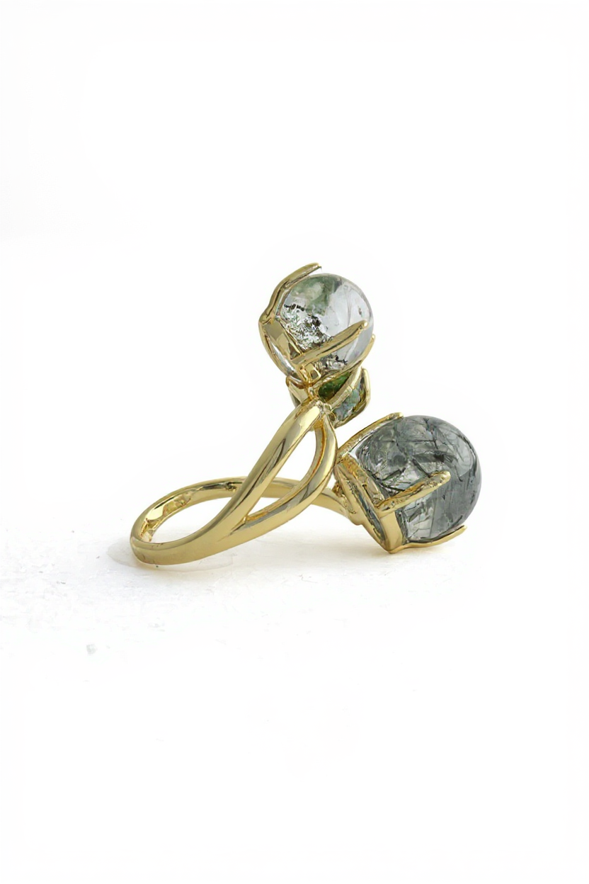 Side view of actinolite quartz, phantom quartz and chrome diopside ring with gold tone setting