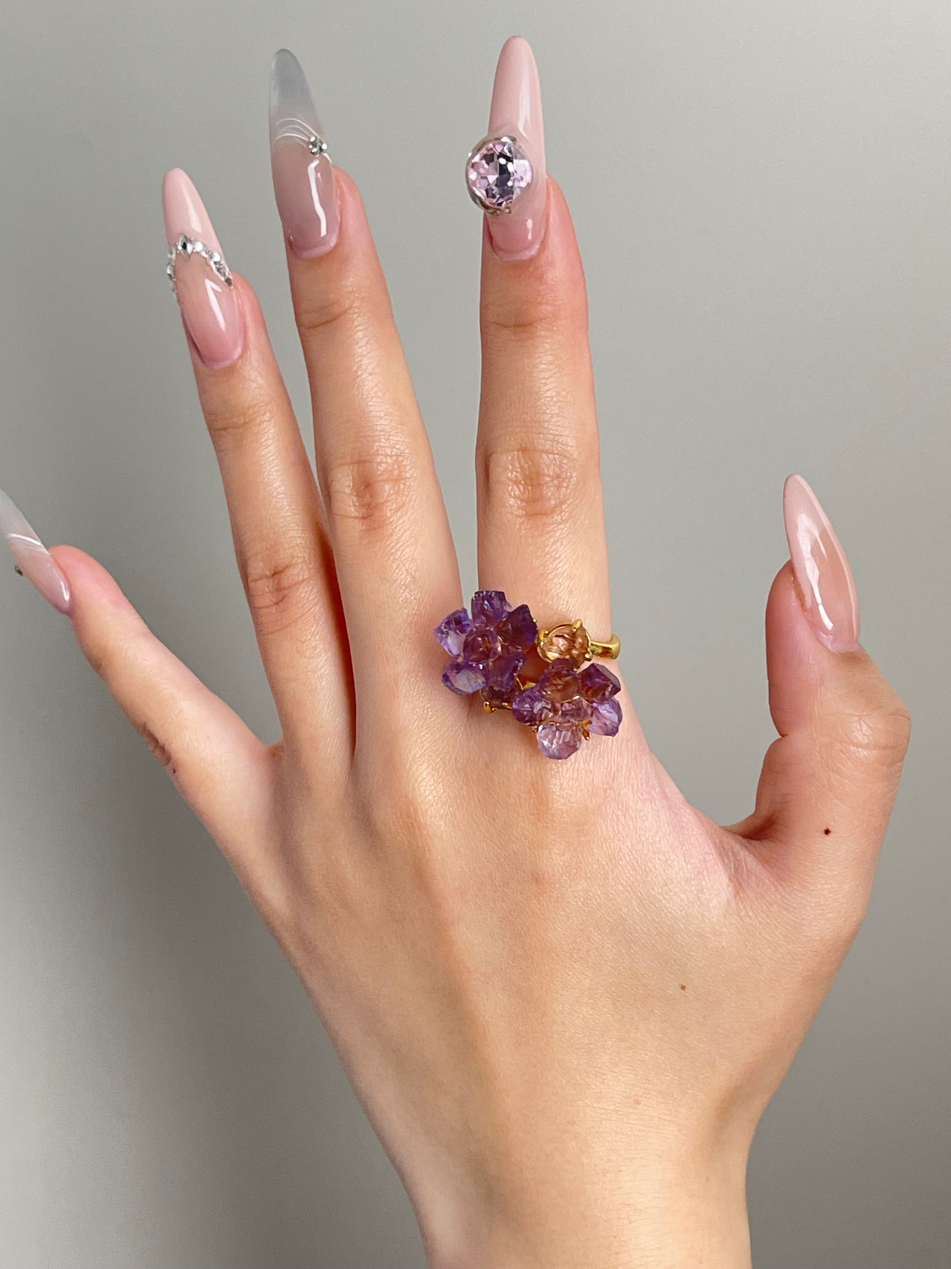 amethyst crystal bloom ring worn on hand