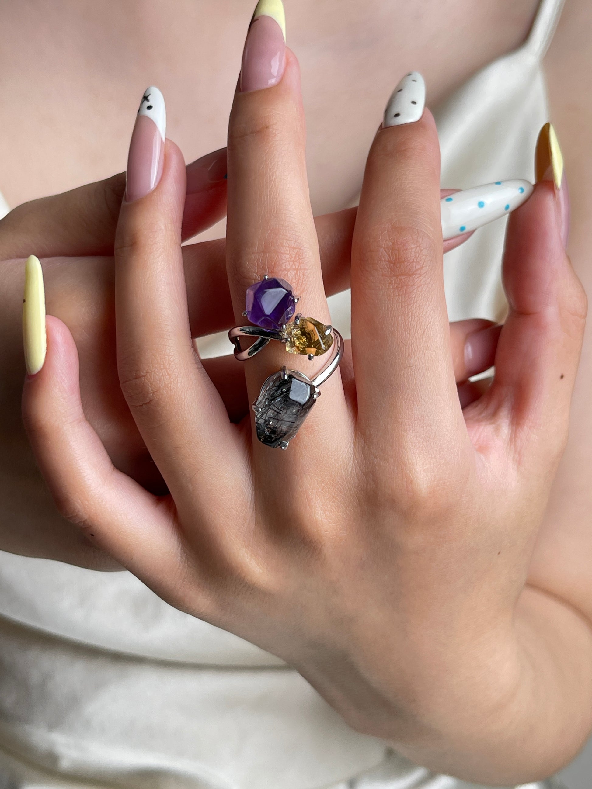 Amethyst, citrine and black tourmalinated quartz crystal ring worn on hand