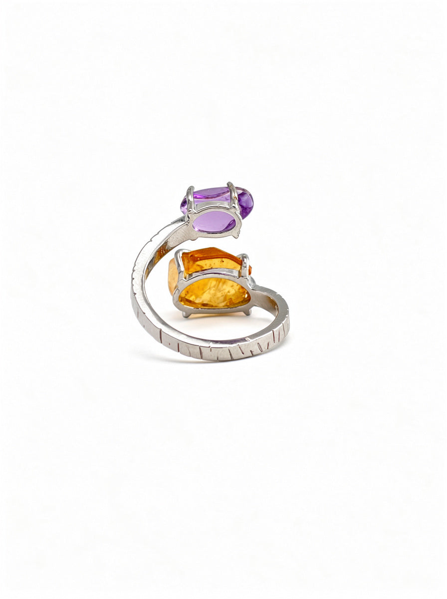 Back view of twin stone crystal ring with open band