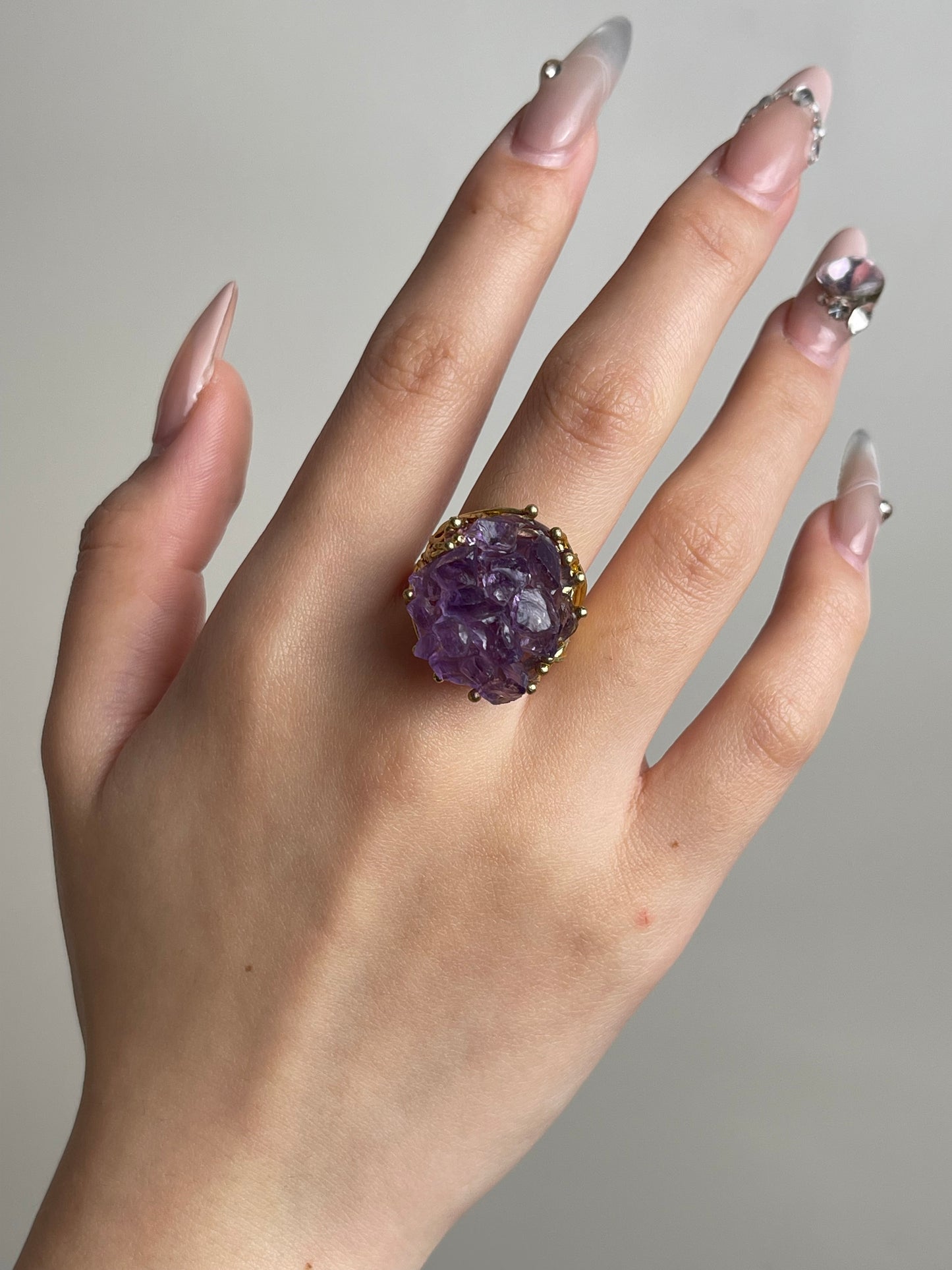 Amethyst cluster raw crystal bouquet ring worn on hand
