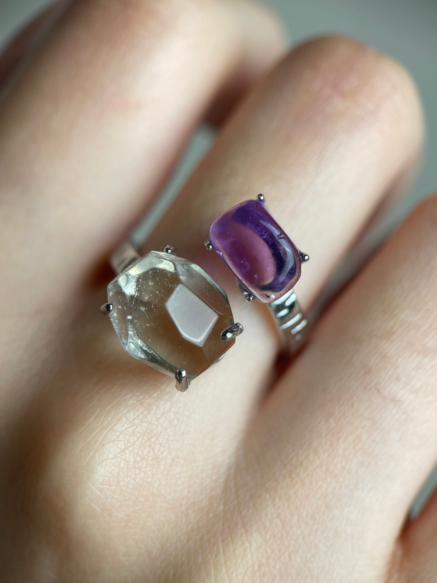 close up of amethyst and green quartz twin ring showing color contrast