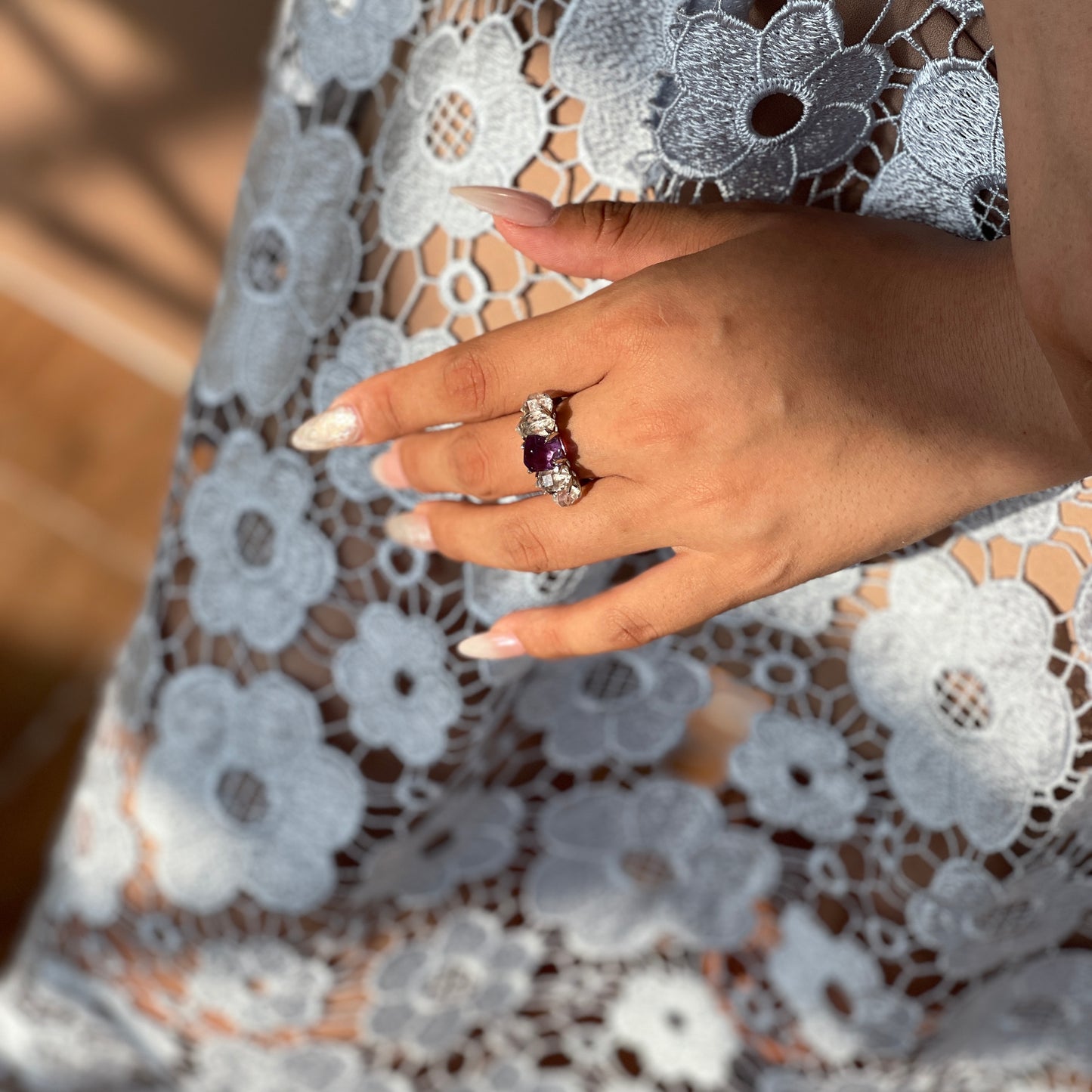Amethyst and Herkimer Diamond Quartz band ring worn on hand, showing freeform purple amethyst and clear natural crystals