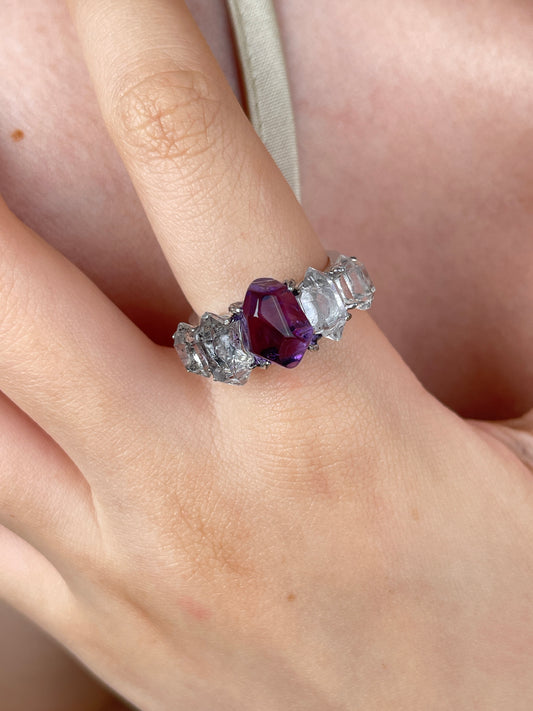 Amethyst and Herkimer Diamond Quartz band ring worn on hand, showing freeform purple amethyst and clear natural crystals