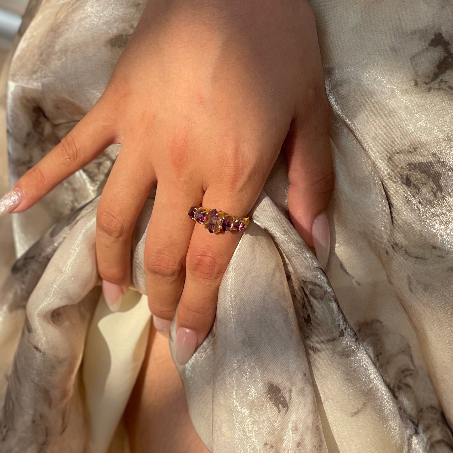 amethyst-super-seven-ring-hand-close-up