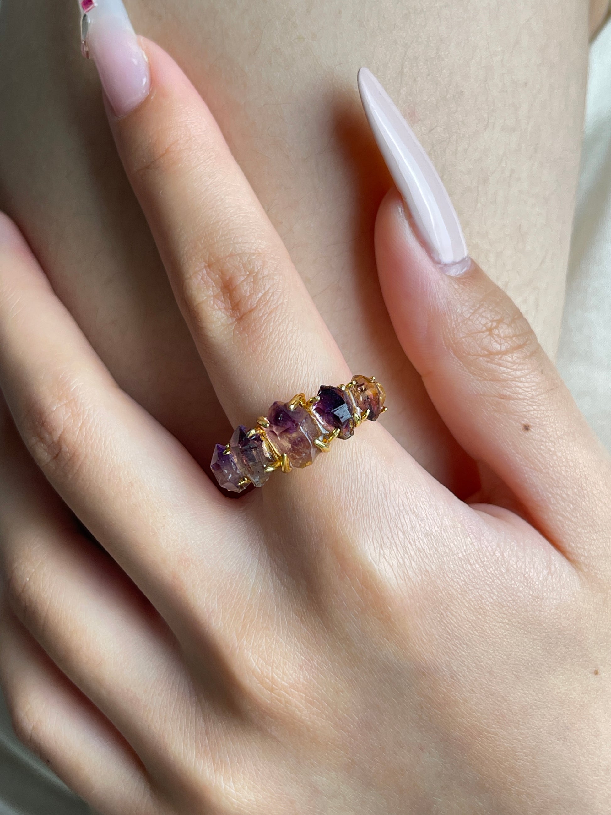 amethyst-super-seven-ring-hand-close-up