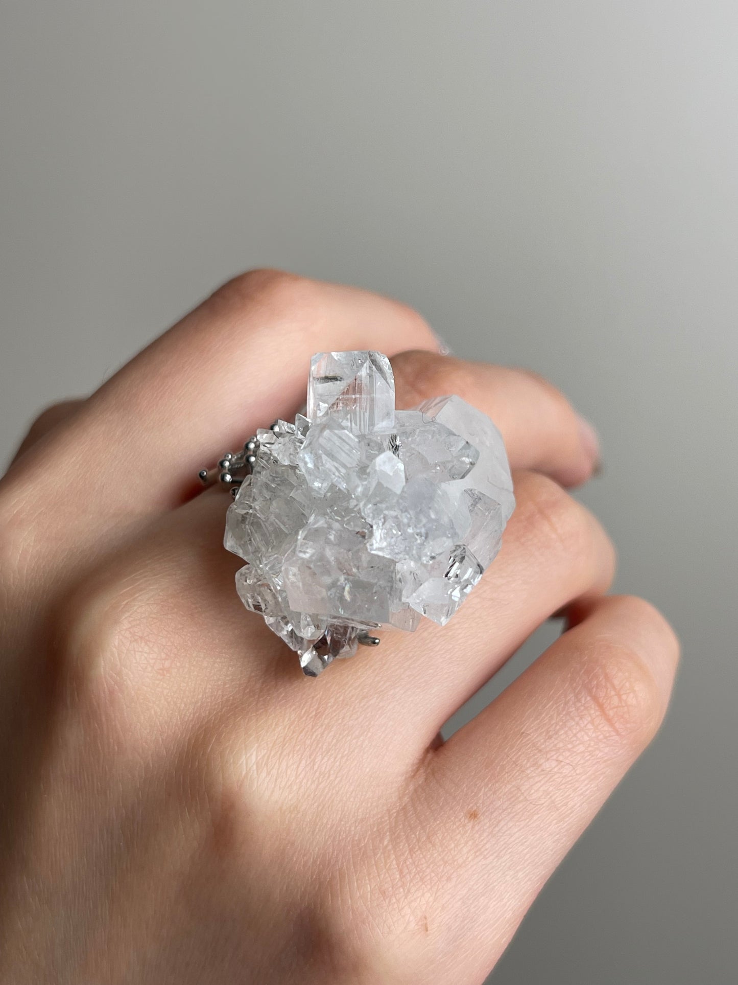 Apophyllite mineral specimen ring close-up on hand