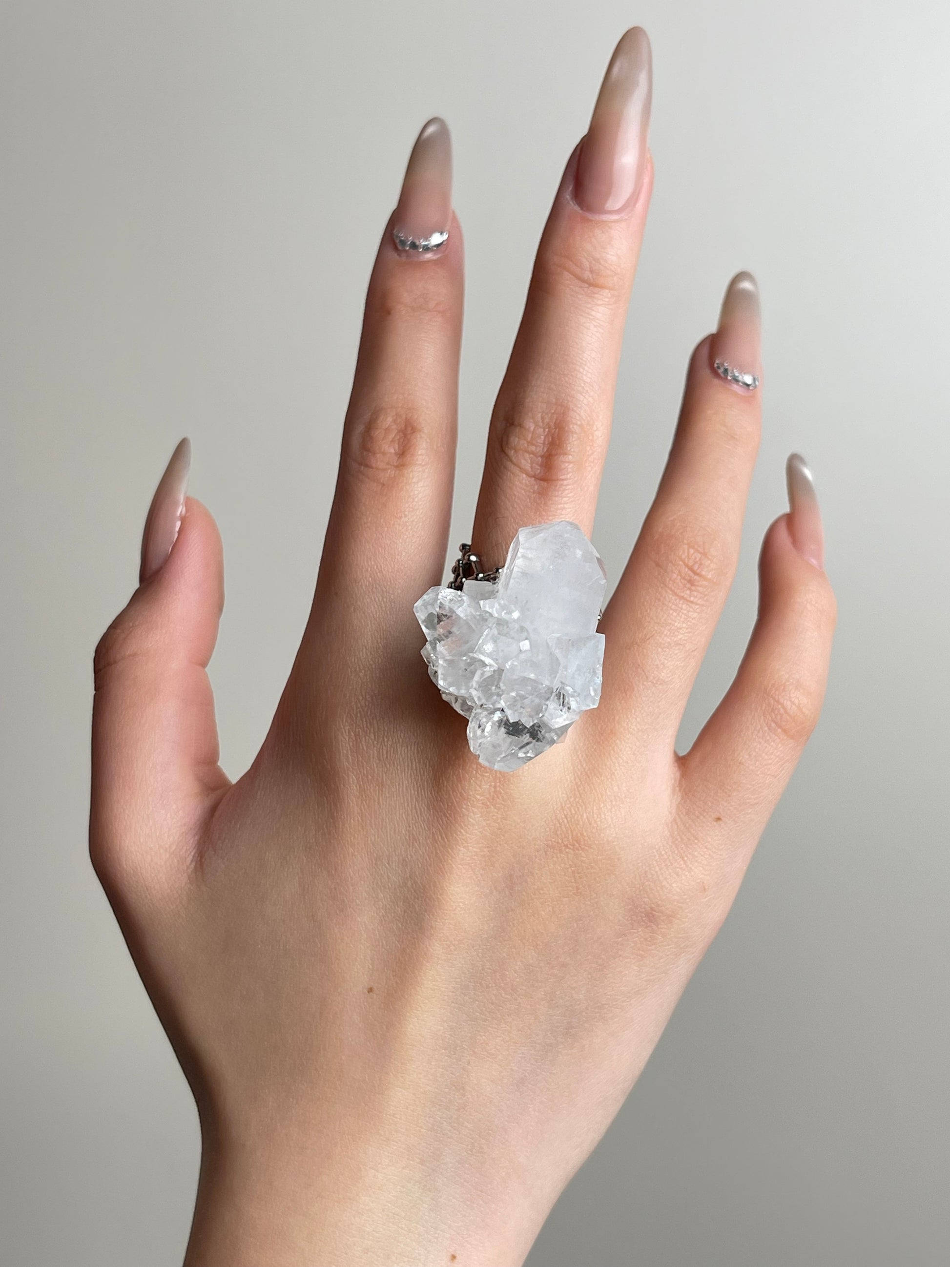 Apophyllite mineral specimen ring worn on hand
