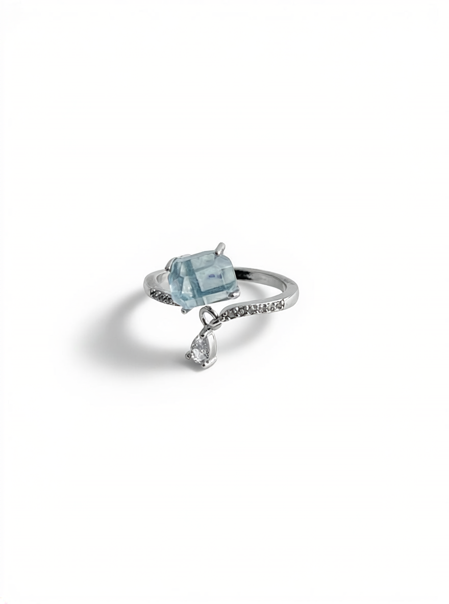 Hand-cut aquamarine ring front view showing soft blue crystal