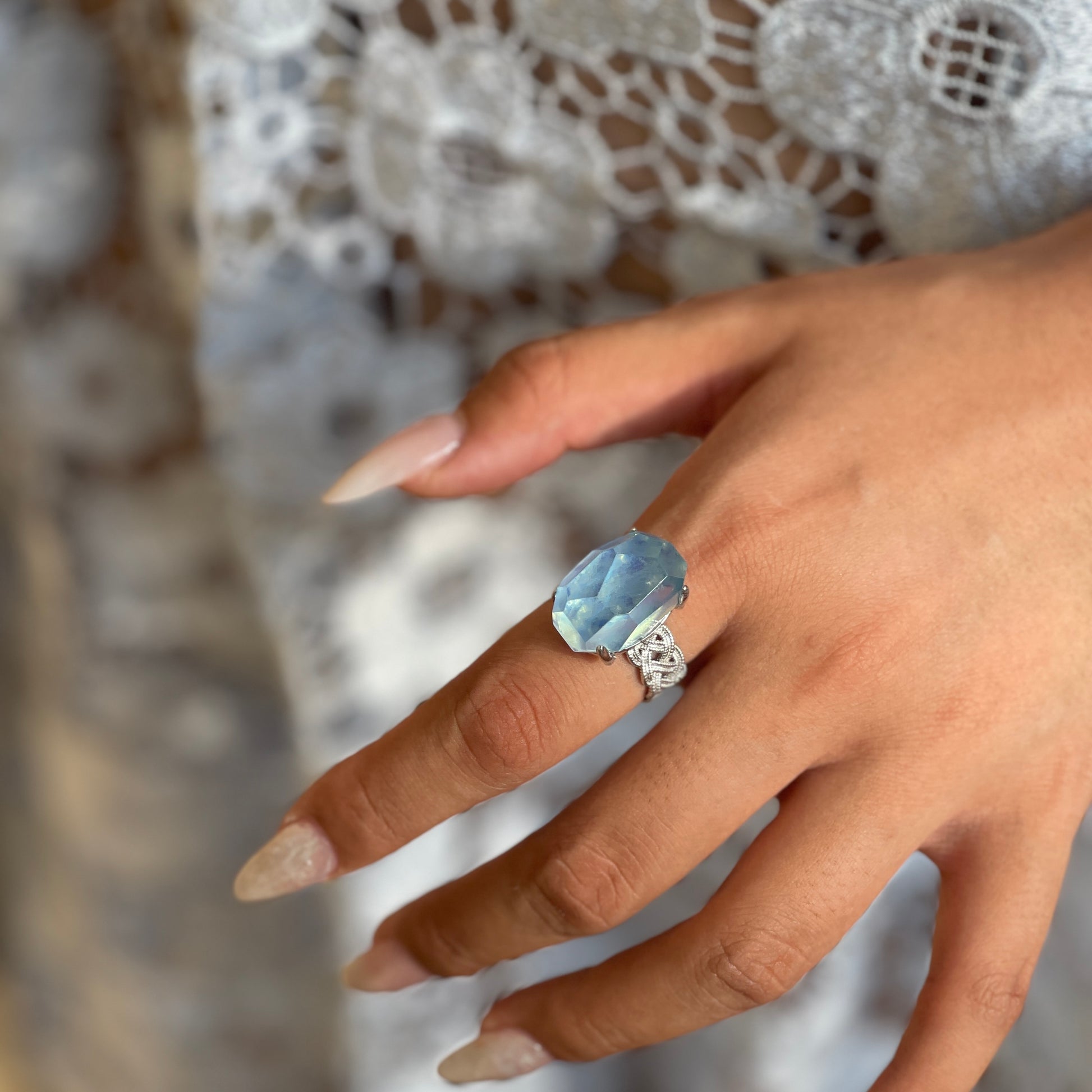 Close-up of Aquamarine freeform ring worn on hand