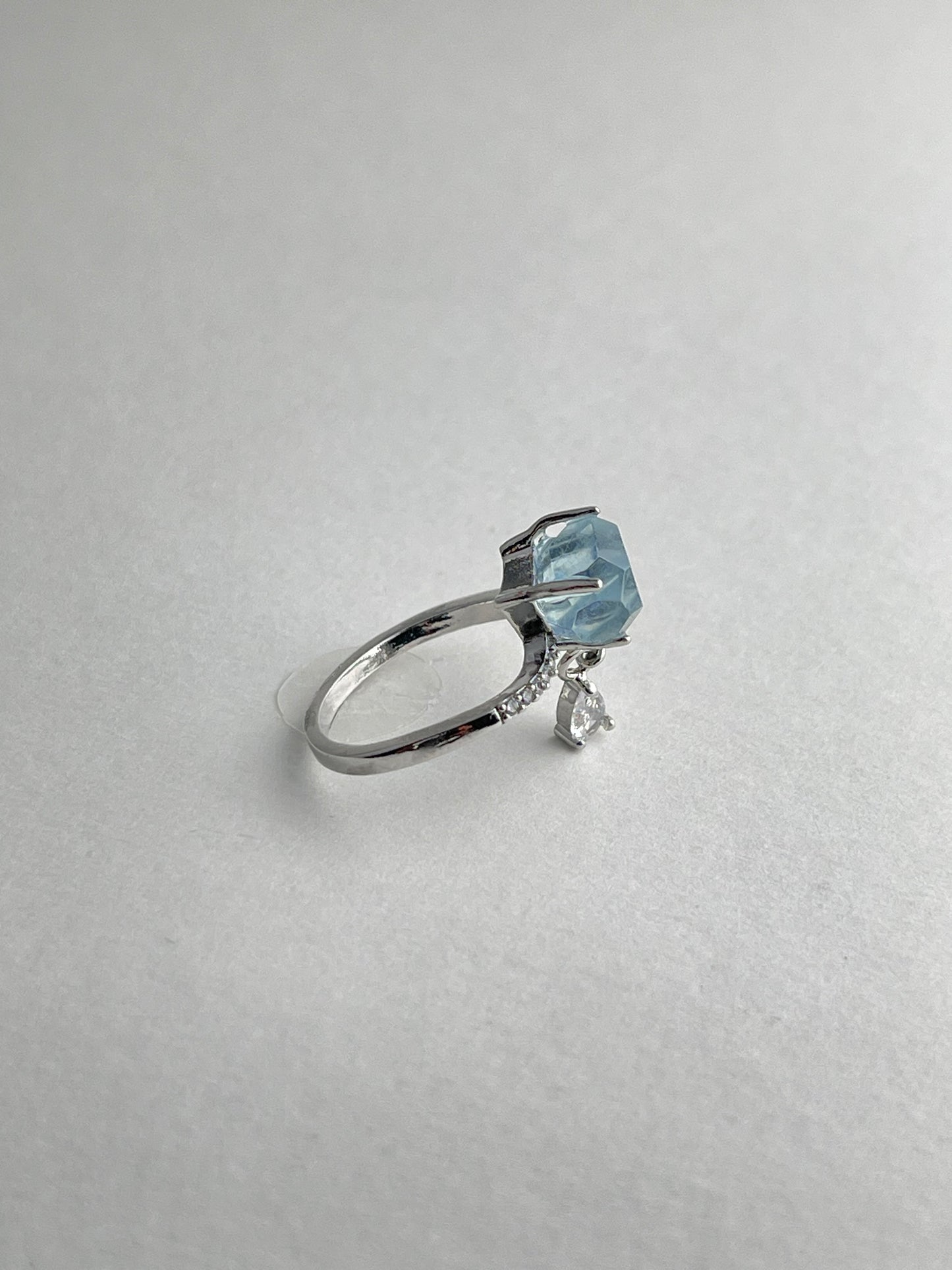 Side view of aquamarine ring with adjustable band