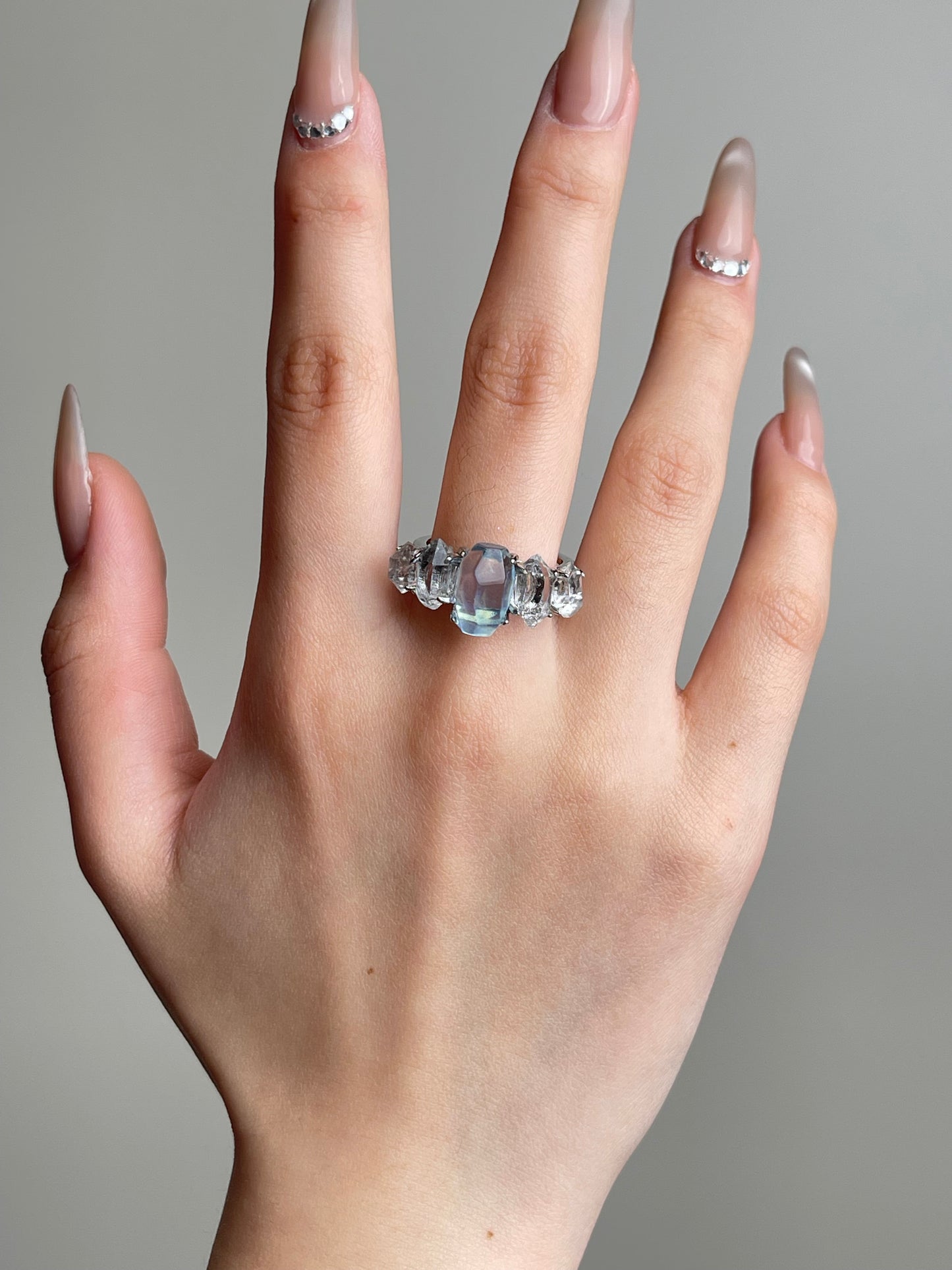 Aquamarine and Herkimer Diamond Quartz Ring worn on hand