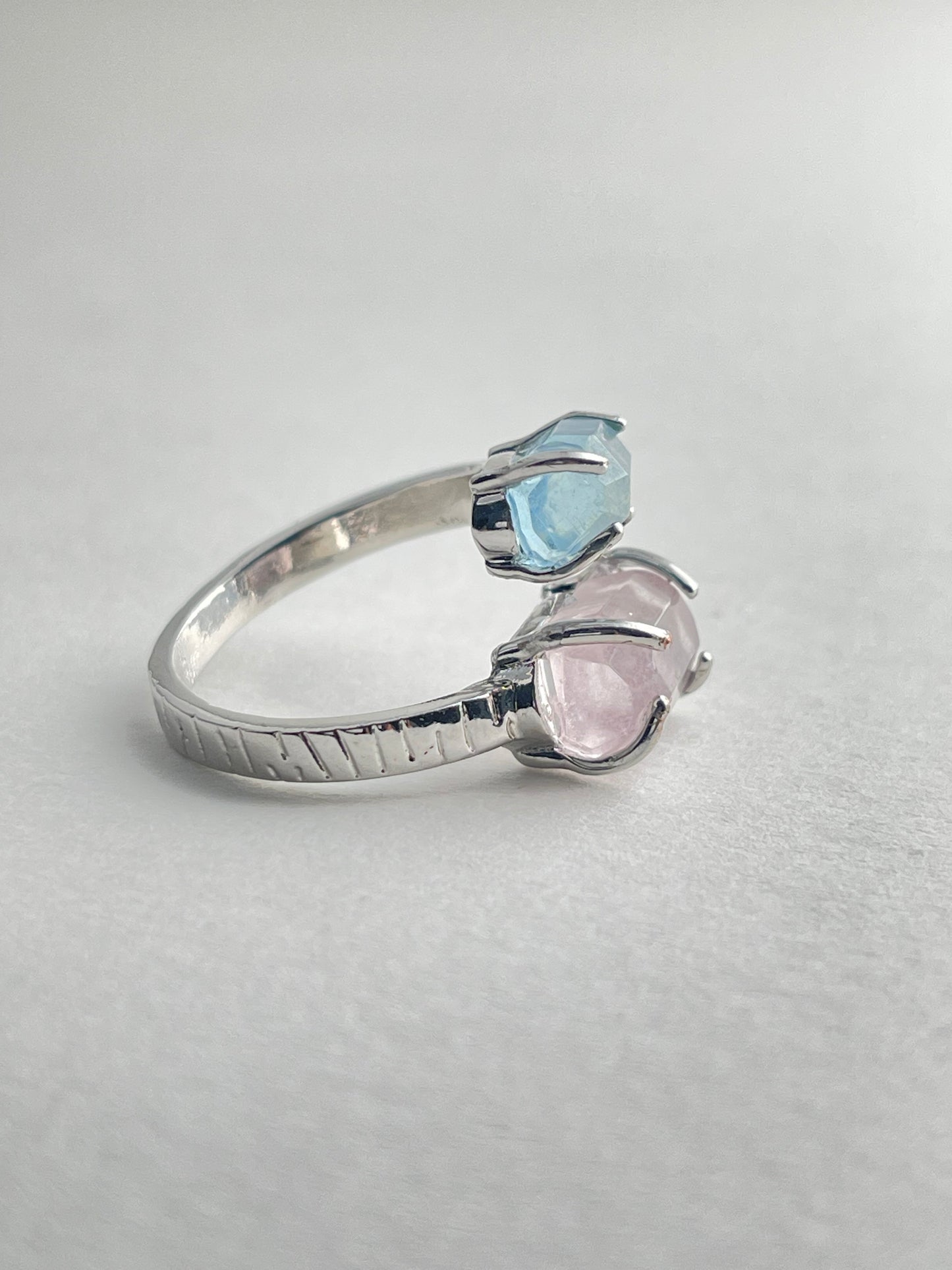 Side view of Aquamarine and Morganite twin stone ring with adjustable open band