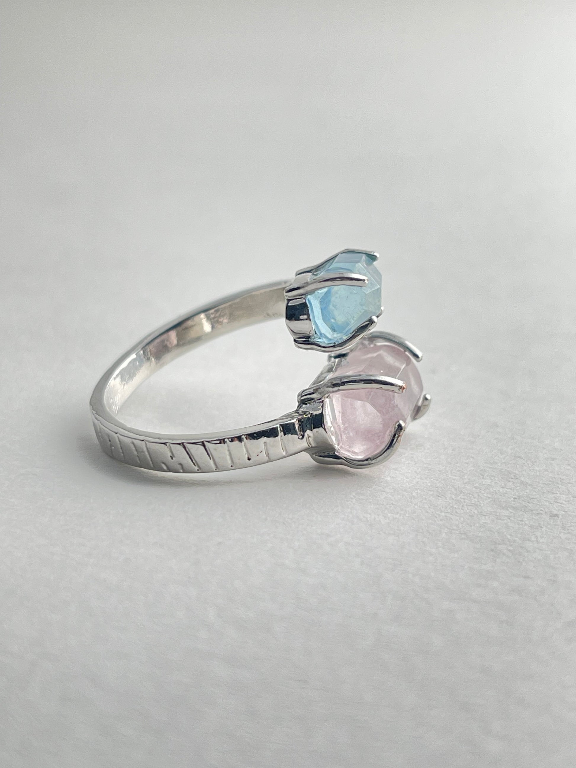 Side view of Aquamarine and Morganite twin stone ring with adjustable open band