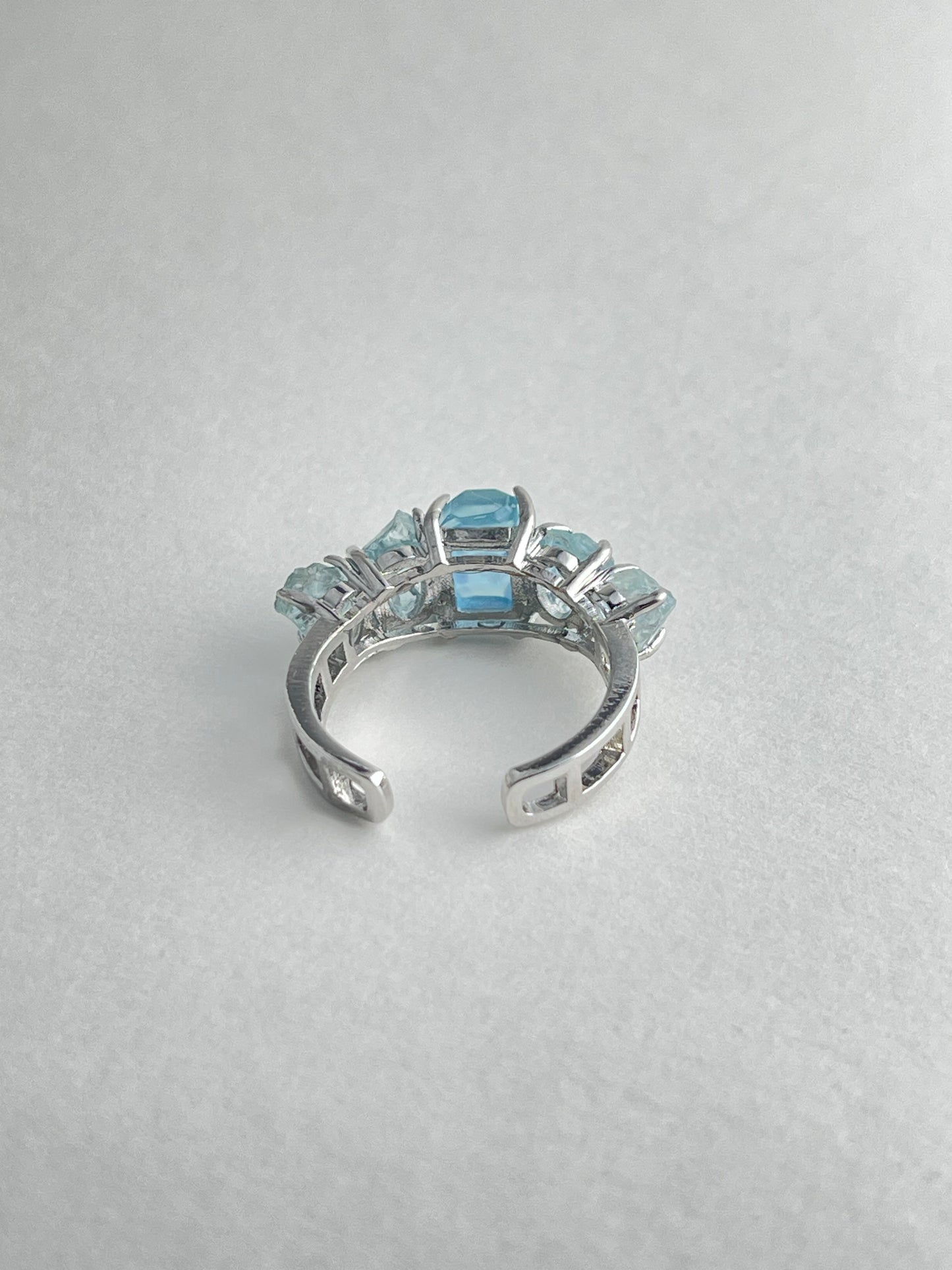 Back view of aquamarine row ring adjustable band natural crystal jewelry